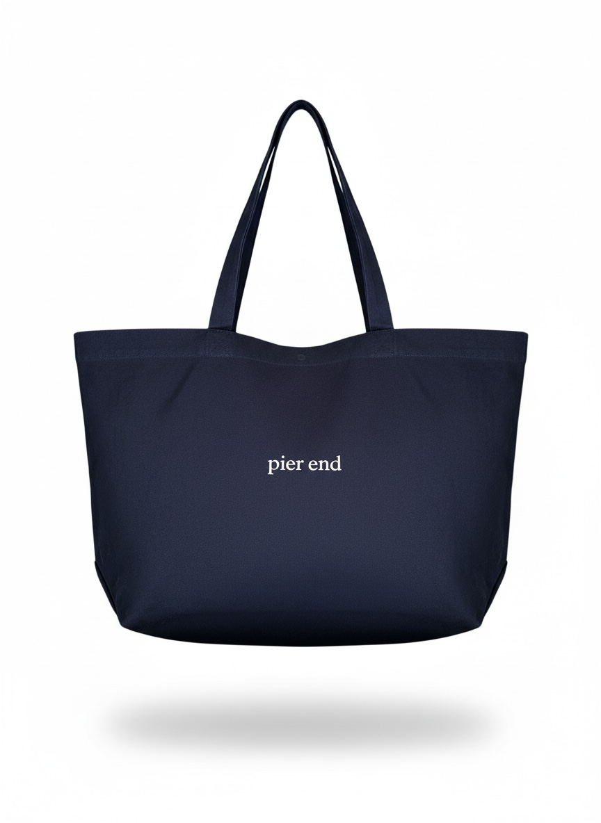 Extra large navy canvas tote bag with bone Pier End print, front view