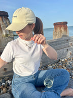 Oyster Pier End cap being worn at the beach
