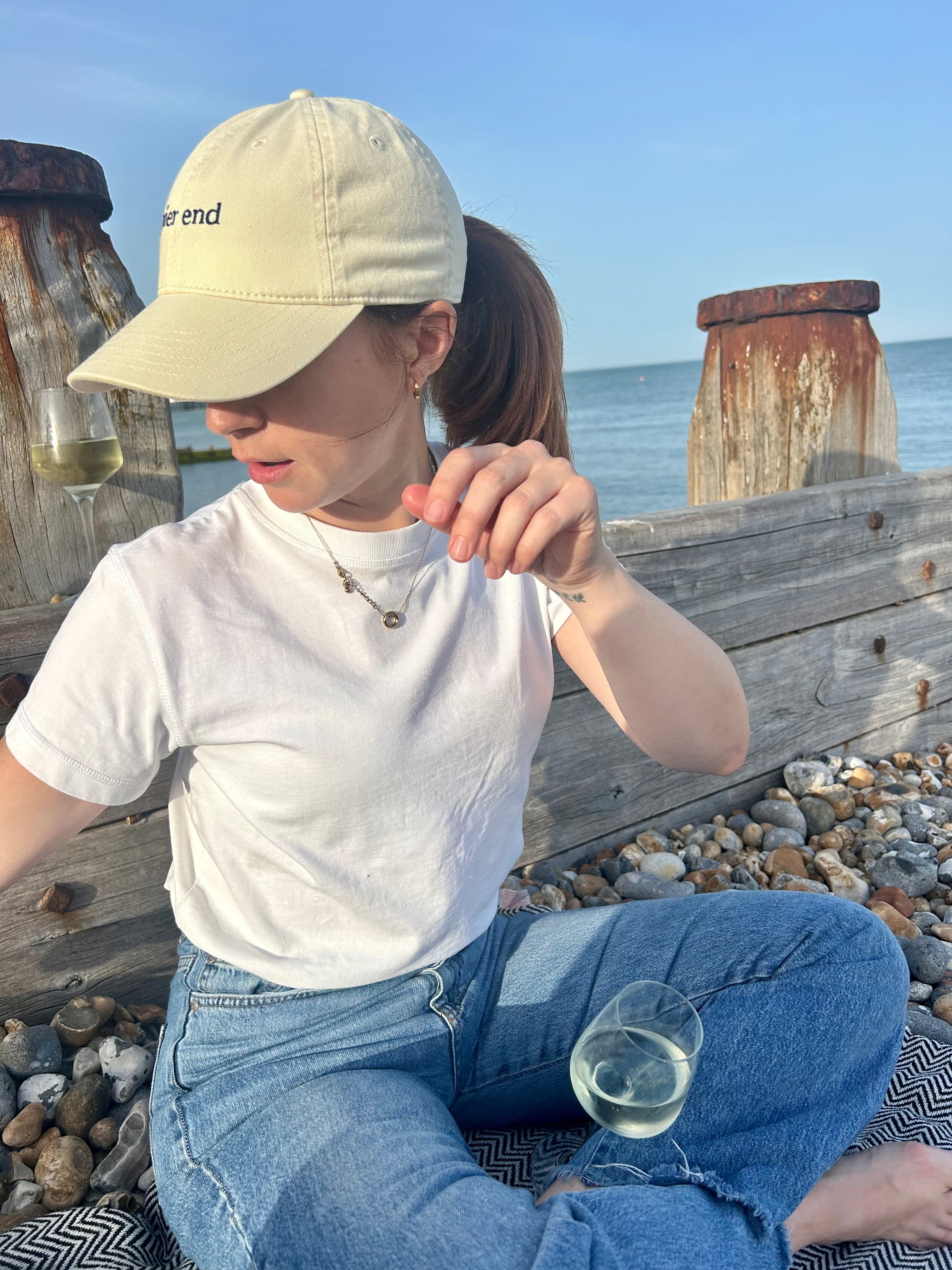 Oyster Pier End cap being worn at the beach