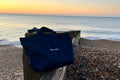  XL navy canvas tote sat at the beach at sunrise