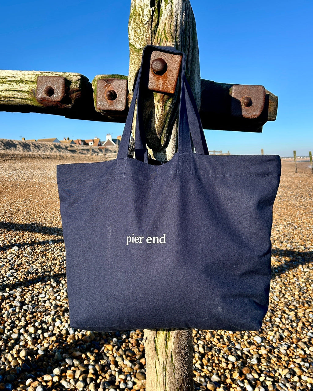  XL navy canvas tote hanging at the beach