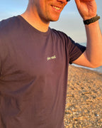 Male customer wearing the navy crewneck tshirt on the beach at sunset