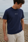 Navy organic cotton t-shirt worn on the beach 